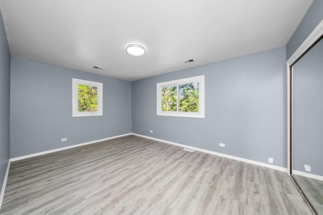 176 Monee Rd, Park Forest, IL 60466 - spare room featuring wood finished floors and baseboards