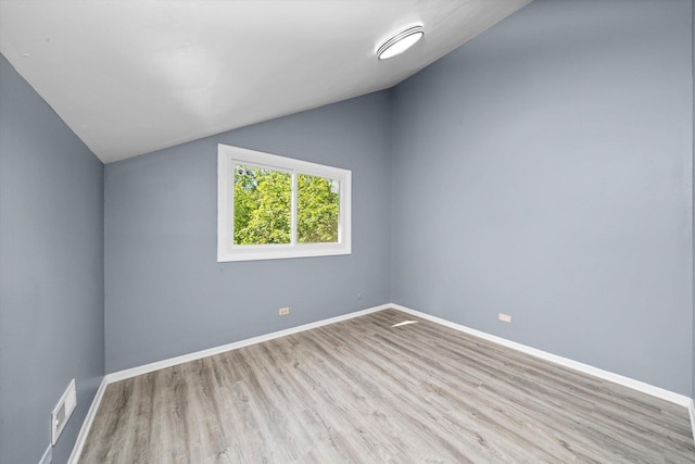 176 Monee Rd, Park Forest, IL 60466 - bonus room with lofted ceiling, wood finished floors, and baseboards