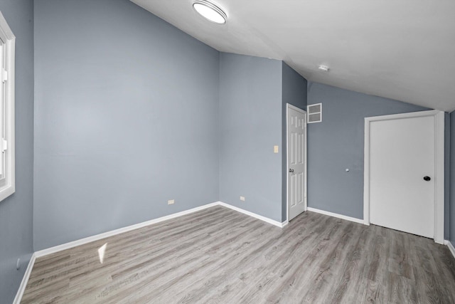 176 Monee Rd, Park Forest, IL 60466 - additional living space featuring lofted ceiling, wood finished floors, and baseboards