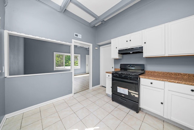 176 Monee Rd, Park Forest, IL 60466 - kitchen with black gas range, under cabinet range hood, white cabinetry, high vaulted ceiling, and baseboards