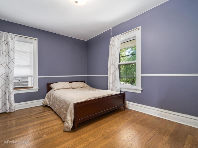 739 N E Ave, Oak Park, IL 60302 - bedroom featuring wood finished floors, baseboards, and cooling unit