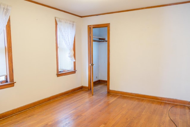 4948 S Lamon Ave, Chicago, IL 60638 - unfurnished bedroom featuring light wood-style flooring, baseboards, and ornamental molding