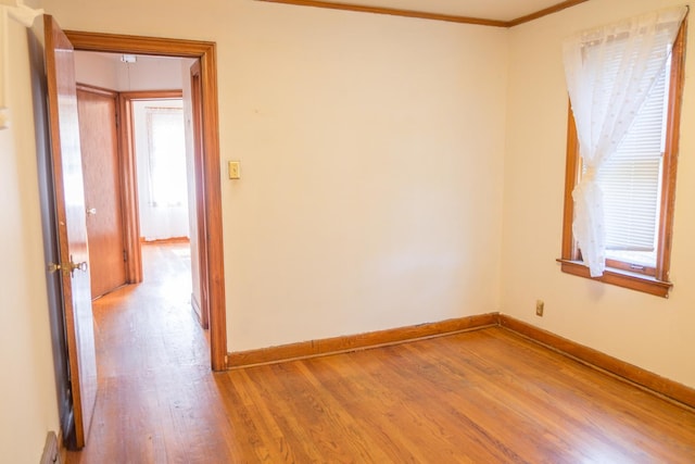 4948 S Lamon Ave, Chicago, IL 60638 - spare room with light wood-type flooring, baseboards, and ornamental molding