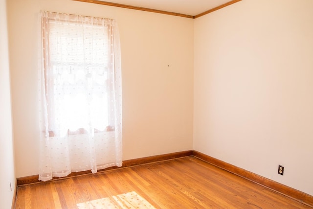 4948 S Lamon Ave, Chicago, IL 60638 - unfurnished room featuring light wood-type flooring, ornamental molding, and baseboards