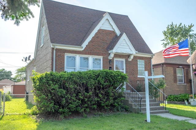 4948 S Lamon Ave, Chicago, IL 60638 - tudor house featuring brick siding and roof with shingles