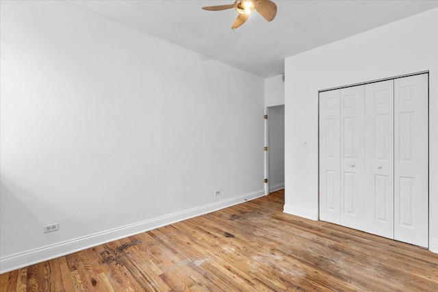 6812 N Wayne Ave Unit 1G, Chicago, IL 60626 - unfurnished bedroom featuring baseboards, light wood finished floors, a closet, and ceiling fan