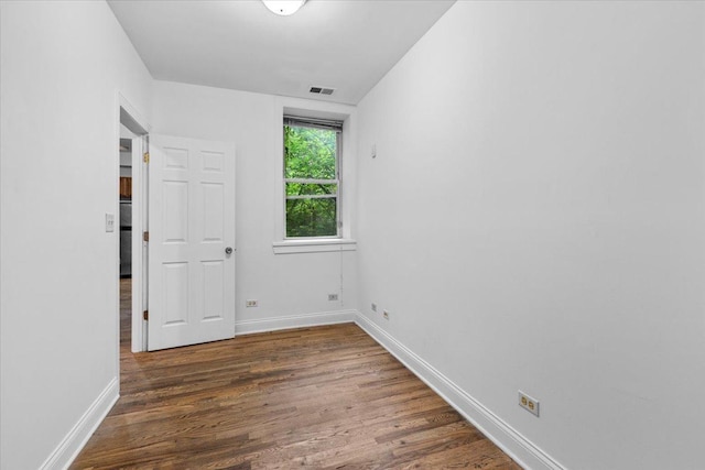 6812 N Wayne Ave Unit 1G, Chicago, IL 60626 - empty room with wood finished floors and baseboards