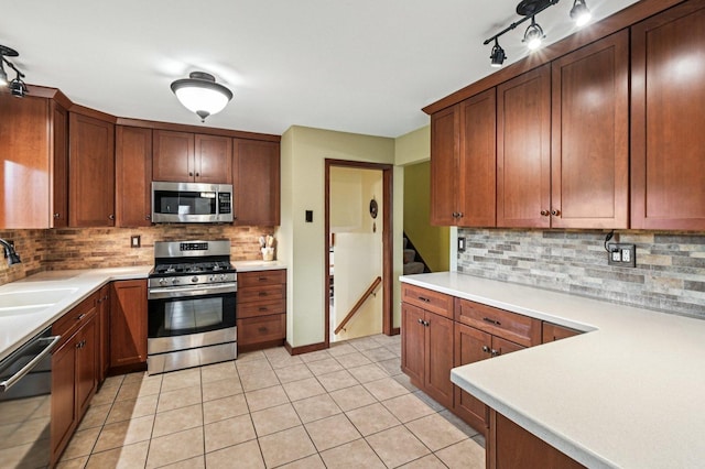 36746 N Eastmoor Ave, Lake Villa, IL 60046 - kitchen with stainless steel appliances, tasteful backsplash, light countertops, and light tile patterned flooring