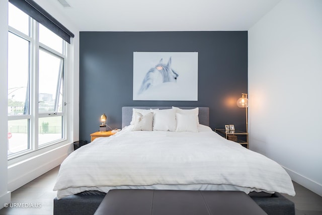 367 W Locust St Unit 202, Chicago, IL 60610 - bedroom featuring an accent wall and baseboards