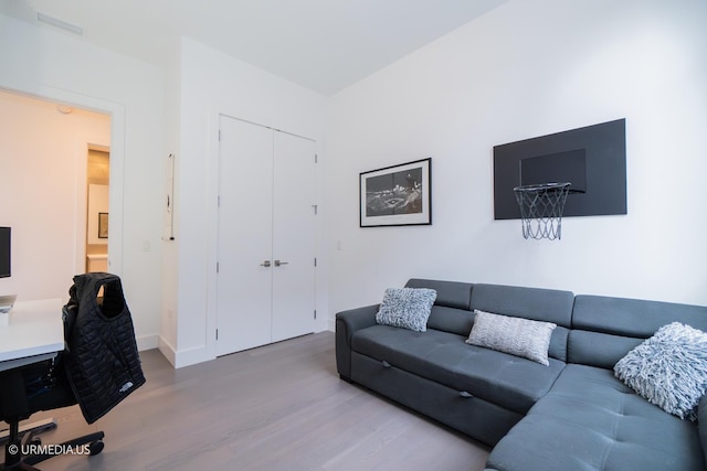 367 W Locust St Unit 202, Chicago, IL 60610 - living area featuring wood finished floors, baseboards, and a desk