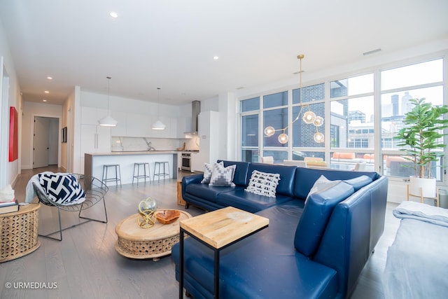 367 W Locust St Unit 202, Chicago, IL 60610 - living room featuring wood finished floors and recessed lighting