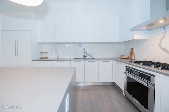 367 W Locust St Unit 202, Chicago, IL 60610 - kitchen with stainless steel appliances, wall chimney exhaust hood, and modern cabinets