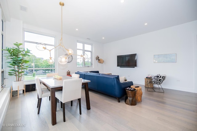 367 W Locust St Unit 202, Chicago, IL 60610 - dining space featuring light wood finished floors, a chandelier, recessed lighting, and baseboards