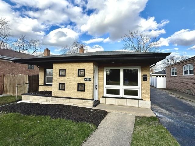 14409 Kimbark Ave, Dolton, IL 60419 - back of house featuring a chimney, brick siding, an outbuilding, and a garage