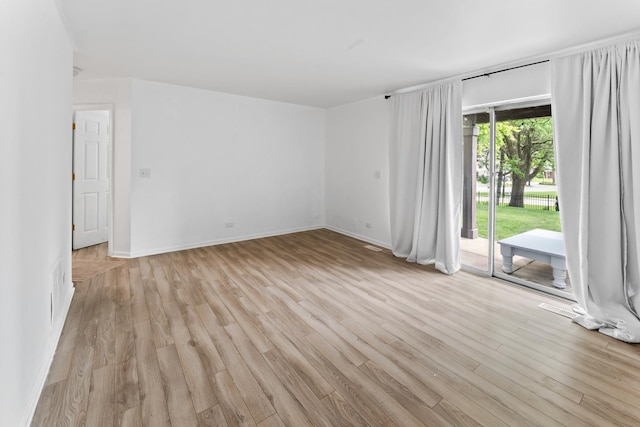 2827 S Embers Ln Unit 0, Arlington Heights, IL 60005 - spare room featuring light wood finished floors and baseboards