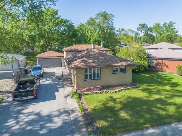 34 E 159th St, South Holland, IL 60473 - view of front facade with brick siding, a detached garage, an outbuilding, and a front yard