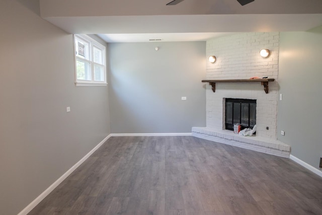 34 E 159th St, South Holland, IL 60473 - unfurnished living room featuring wood finished floors, baseboards, and a brick fireplace