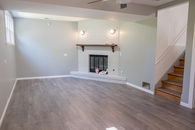 34 E 159th St, South Holland, IL 60473 - unfurnished living room featuring wood finished floors, a ceiling fan, baseboards, and stairs