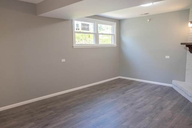34 E 159th St, South Holland, IL 60473 - below grade area featuring dark wood-style floors, baseboards, and a fireplace