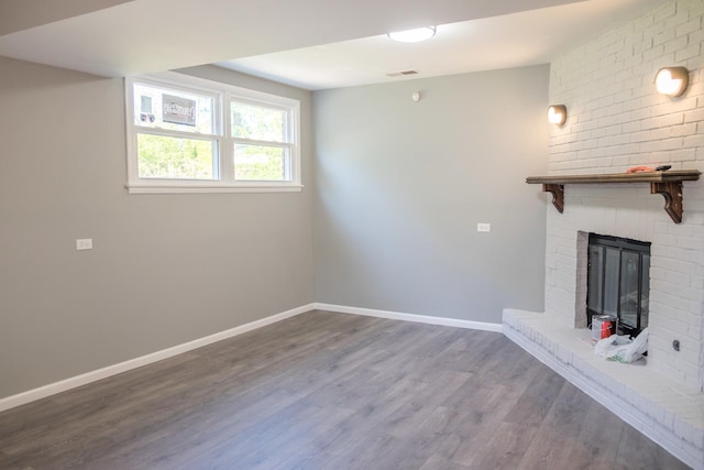 34 E 159th St, South Holland, IL 60473 - unfurnished living room with baseboards, wood finished floors, and a fireplace