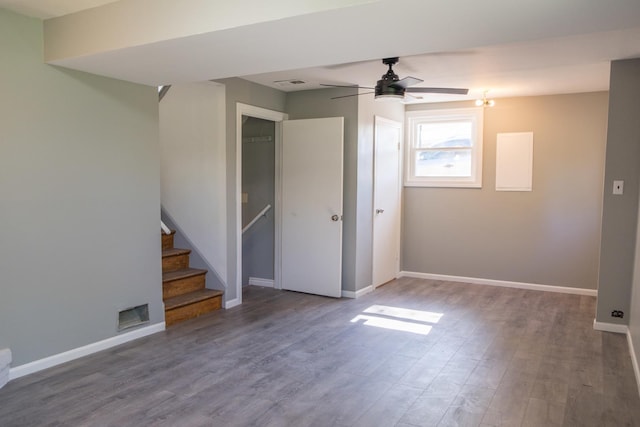 34 E 159th St, South Holland, IL 60473 - empty room featuring a ceiling fan, wood finished floors, baseboards, and stairway