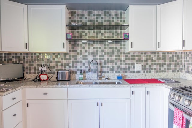34 E 159th St, South Holland, IL 60473 - kitchen featuring a sink, stainless steel range with gas cooktop, and white cabinets