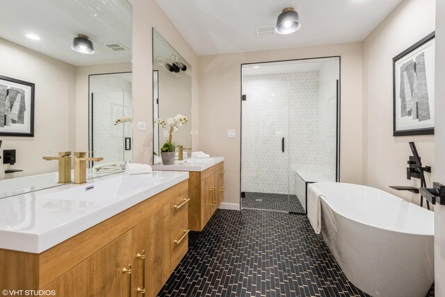 725 Locust Rd, Wilmette, IL 60091 - full bathroom featuring a stall shower, two vanities, and a freestanding bath