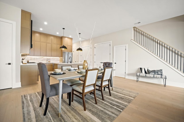 4343 N Richmond Ave Unit 3N, Chicago, IL 60618 - dining room with light wood-style floors, recessed lighting, and stairs