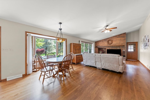 1527 62nd St, Downers Grove, IL 60516 - dining area with vaulted ceiling, ceiling fan, wood finished floors, and a fireplace