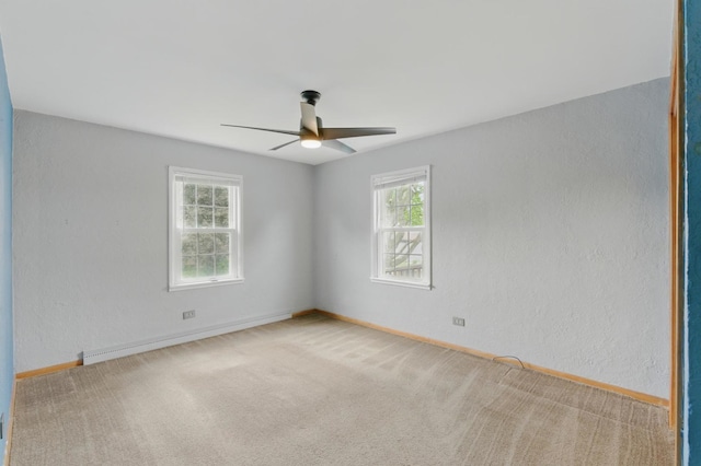 2236 Thornton Lansing Rd, Lansing, IL 60438 - empty room featuring a ceiling fan, healthy amount of natural light, carpet flooring, and baseboards