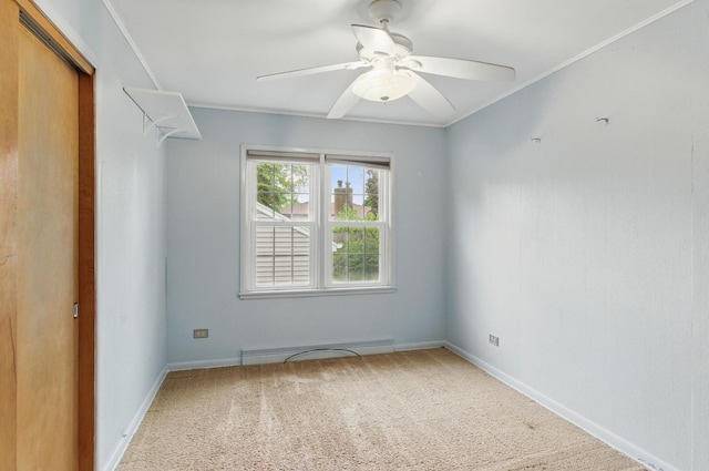 2236 Thornton Lansing Rd, Lansing, IL 60438 - carpeted spare room featuring a baseboard radiator, ceiling fan, crown molding, and baseboards