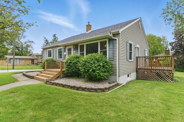 2236 Thornton Lansing Rd, Lansing, IL 60438 - view of front facade featuring a wooden deck, a chimney, and a front yard