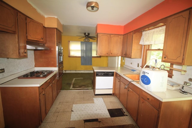 20340 Keeler Ave, Matteson, IL 60443 - kitchen with white dishwasher, under cabinet range hood, stainless steel gas stovetop, and light countertops