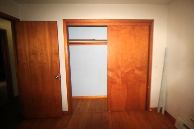 20340 Keeler Ave, Matteson, IL 60443 - hallway featuring wood finished floors, baseboards, and a baseboard radiator