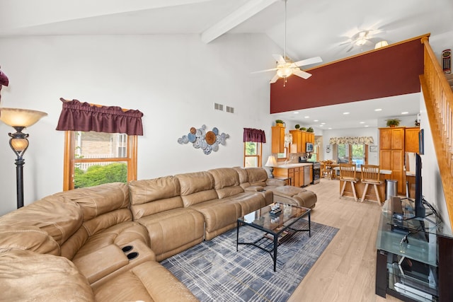 595 Sudbury Cir, Oswego, IL 60543 - living area with a ceiling fan, light wood-style flooring, beamed ceiling, and high vaulted ceiling