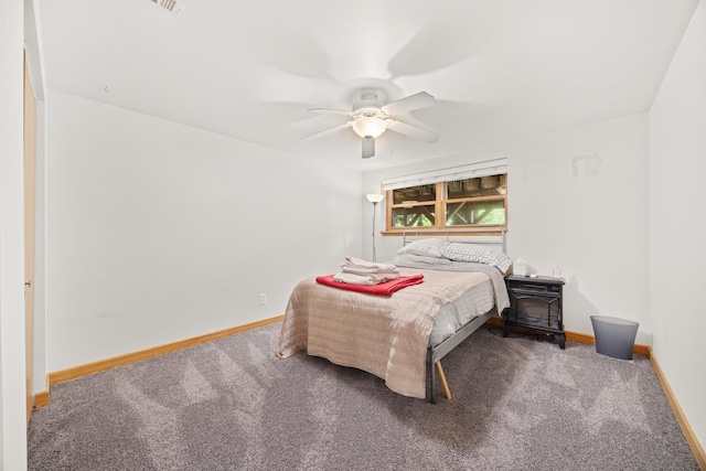 595 Sudbury Cir, Oswego, IL 60543 - carpeted bedroom with baseboards and ceiling fan