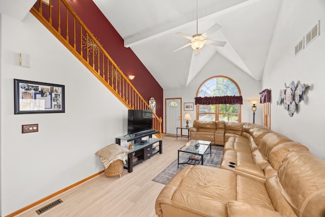 595 Sudbury Cir, Oswego, IL 60543 - living room with stairs, wood finished floors, a ceiling fan, high vaulted ceiling, and baseboards