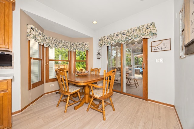 595 Sudbury Cir, Oswego, IL 60543 - dining area featuring light wood-style flooring, baseboards, healthy amount of natural light, and recessed lighting