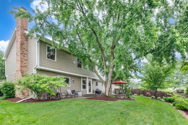 27W317 Victoria Ln, Winfield, IL 60190 - back of house featuring a chimney and a patio area