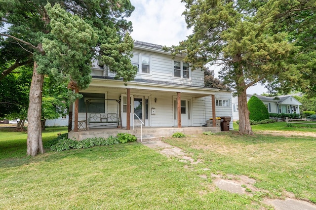4 E Lincoln St, Mount Morris, IL 61054 - view of front of home featuring a porch and a front lawn