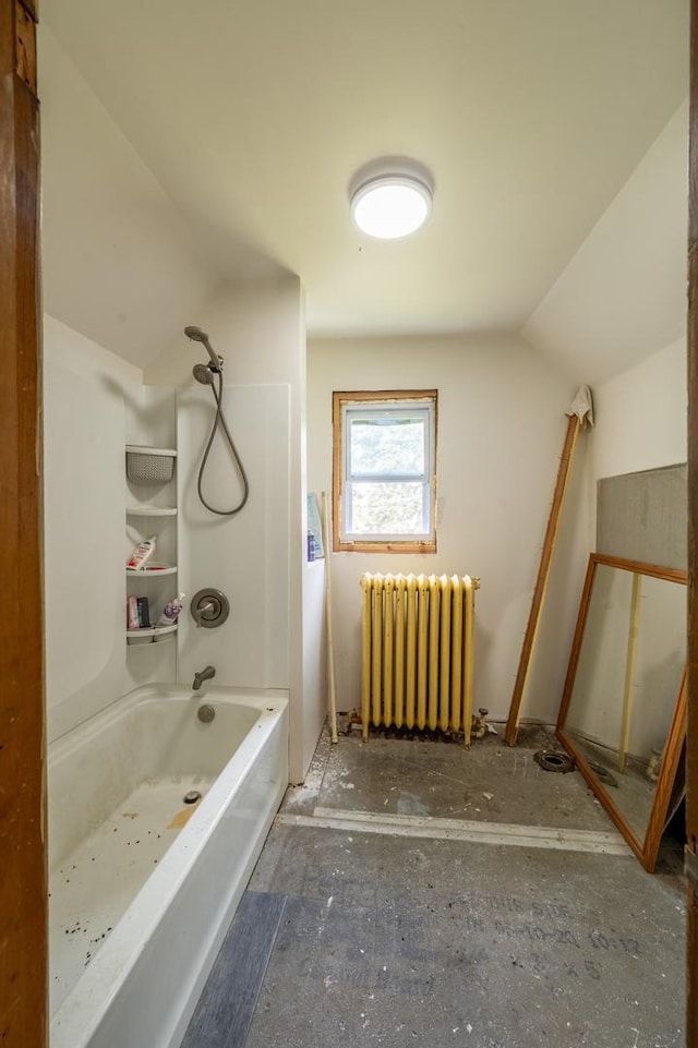 4 E Lincoln St, Mount Morris, IL 61054 - bathroom featuring radiator, lofted ceiling, and bathing tub / shower combination