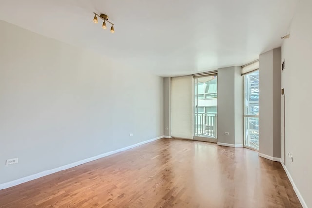 645 N Kingsbury St Unit 1203, Chicago, IL 60654 - unfurnished room featuring wood finished floors and baseboards