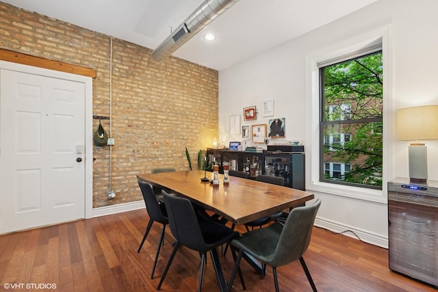 1956 W Bradley Pl Unit 2W, Chicago, IL 60613 - dining space featuring brick wall, wine cooler, and wood finished floors