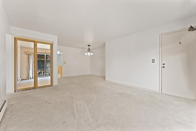 2155 N Harlem Ave Unit 205, Chicago, IL 60707 - empty room featuring a chandelier, light carpet, and a baseboard radiator