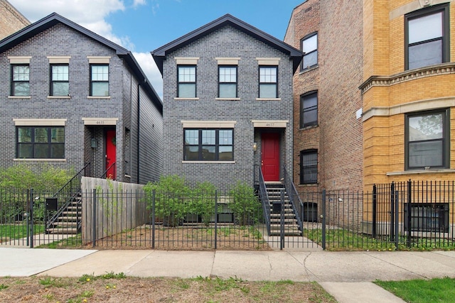4637 S Michigan Ave, Chicago, IL 60653 - view of front of house with brick siding and a fenced front yard