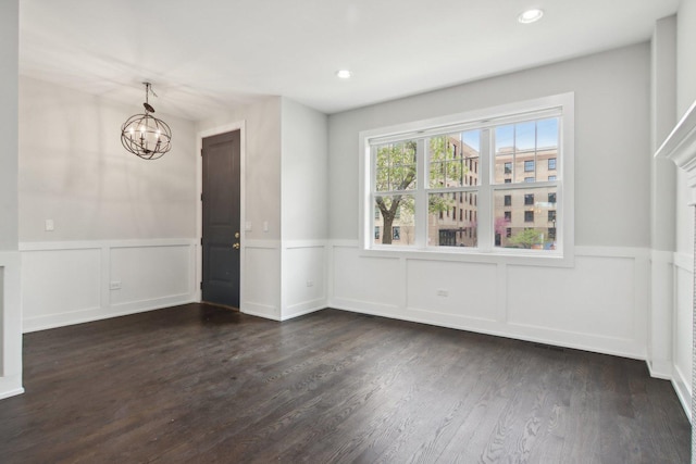 4637 S Michigan Ave, Chicago, IL 60653 - unfurnished dining area featuring a chandelier, wainscoting, a decorative wall, dark wood finished floors, and recessed lighting