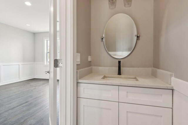 4637 S Michigan Ave, Chicago, IL 60653 - bathroom with vanity, wood finished floors, wainscoting, and recessed lighting