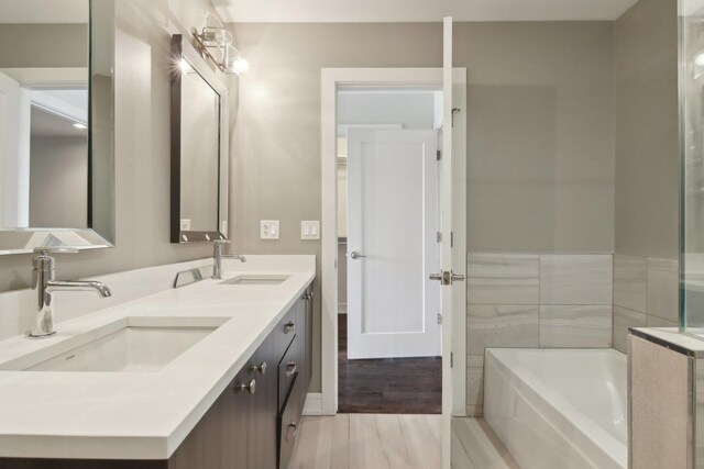 4637 S Michigan Ave, Chicago, IL 60653 - full bath with a bath, double vanity, and wood finished floors