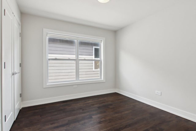4637 S Michigan Ave, Chicago, IL 60653 - unfurnished room with dark wood-style floors and baseboards