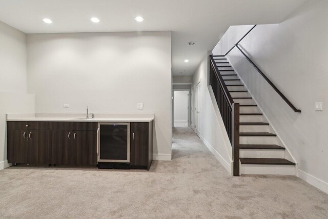 4637 S Michigan Ave, Chicago, IL 60653 - indoor wet bar with wine cooler, light colored carpet, baseboards, stairs, and recessed lighting